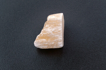 Red Gypsum stone mineral, black background, close-up, black background