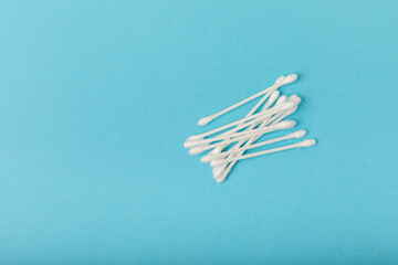 Cotton buds on a blue background. Place for text. Place to copy.Closeup. Hygienic cotton sticks.