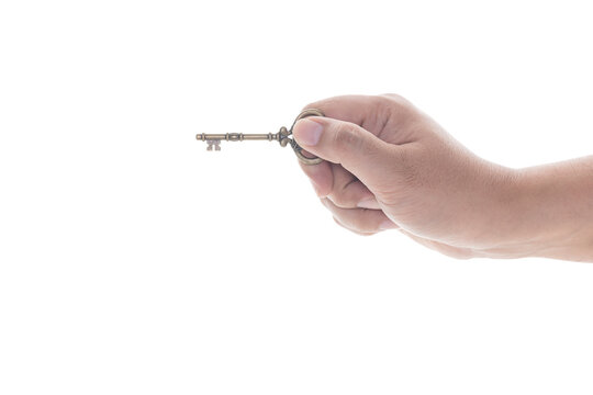 Male hand holding a key isolated on white background with clipping path.