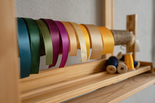 Colorful ribbons on wooden holder
