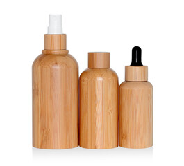 Wooden cosmetic dropper bottles isolated white background. Eco cosmetics and zero waste concept 
