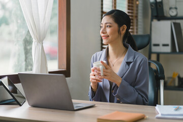 The image depicts a cheerful young businesswoman working in her home office, symbolizing the concept of remote work.