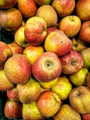Closeup of a heap of colorful tasty apples