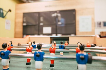 Table football game with red and blue players.