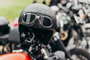 Closeup shot of a black safety helmet on a motorbike