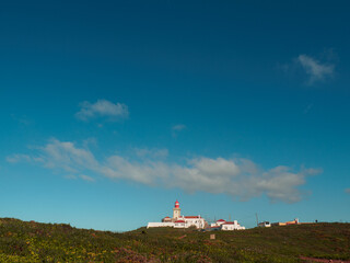 Fototapeta na wymiar Lighthouse from distance, Cabo de Roca, Sintra, Portugal