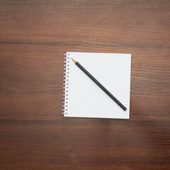 Notebook and pencil on a beautiful background in a photo studio