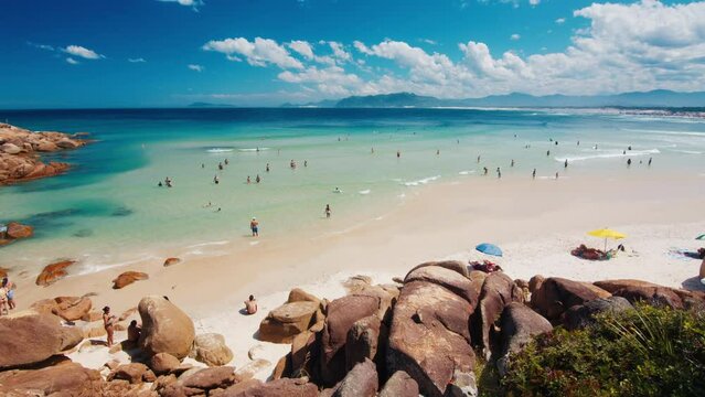 People relax on the famous beach of Guarda do Embau in the state of Santa Catarina in Brazil
