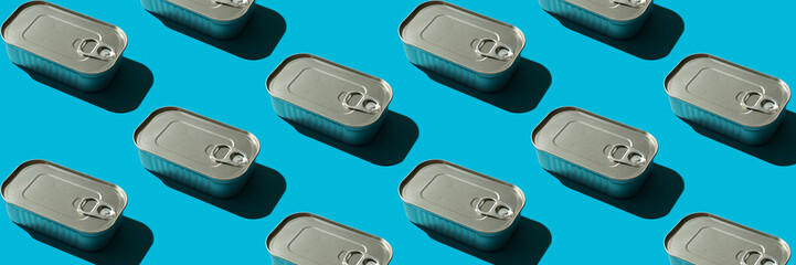 Banner with a pattern with a closed tin can on a blue background with hard shadows, the concept of canned fish at sea or in the ocean