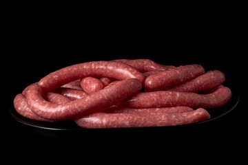 Closeup shot of homemade sausages isolated on a black background