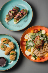 restaurant snacks on a plate and on a gray background