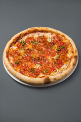 spicy pizza with chili pepper on cut background
