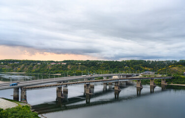 Naklejka premium Sunset over the bridge over the Tom River in Kemerovo