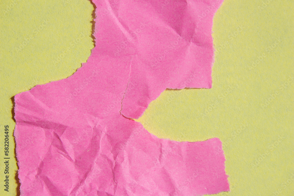 Poster crumpled pink paper piece on a yellow background. torn paper texture background with copy space for 
