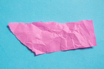 Pink torn paper background. Crumpled paper piece on a blur background. Copy space for text.