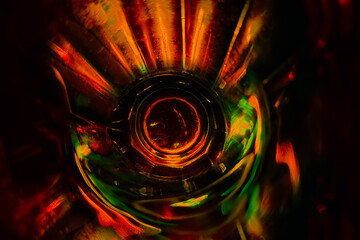 Faceted color glass. Light refraction. Photo. Background