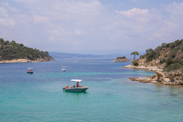 Fototapeta na wymiar Boats in blue lagoon of the Mediterranean