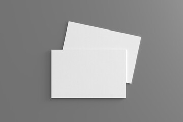 Business card mockup. Pair of business card on gray background. View directly above