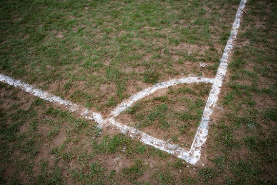 Corner markings on local muddy football pitch