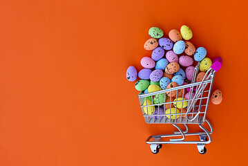 a shopping cart full of easter eggs, easter eggs coming out of shopping cart, banner or postcard with space for text, congratulation, easter day celebration