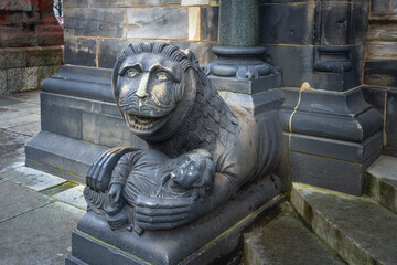 Lion with a man sculpture in front of Bremen Cathedral - Bremen, Germany - obrazy, fototapety, plakaty