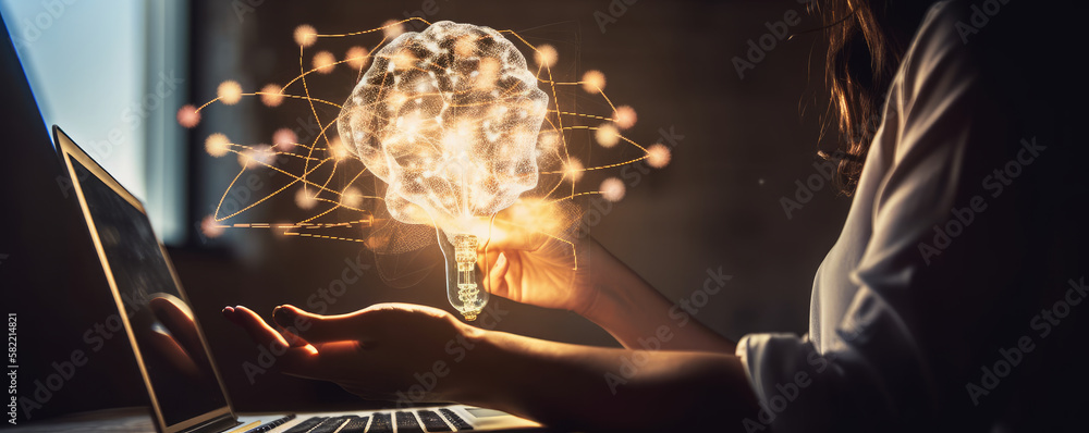 Aufkleber a person holding a light bulb with a shape of human brain inside in front of a laptop. creative idea