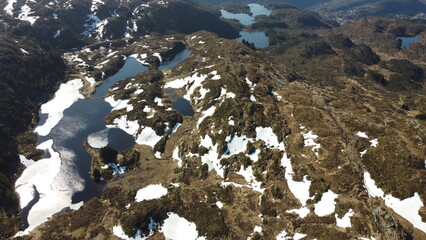 Norway mountains, fjord. Village on the fjord. Summer in Norway. Beautiful landscape. Sun rays through the clouds