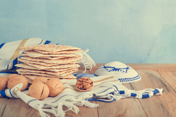 Passover celebration concept. Matzah, red kosher and walnut. Traditional ritual Jewish bread...