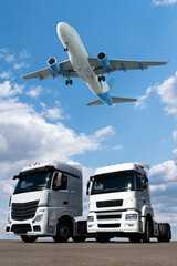 Airplane in the sky above the trucks. World trade and transportation concept	