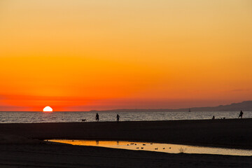 Sun setting in Santa Monica, California over the Pacific Ocean