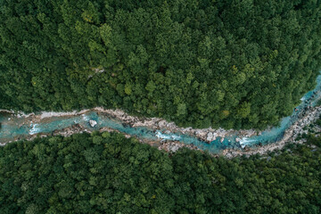 Nature concept. Aerial view photo of river flowing in the forest