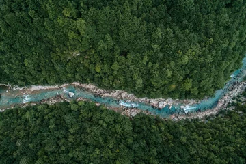 Gardinen Nature concept. Aerial view photo of river flowing in the forest © Goncharuk film