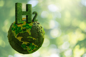 Symbol of Hydrogen H2 from grass and green planet Earth from moss