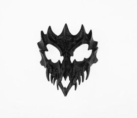 black scary fantasy mask with teeth isolated on white background