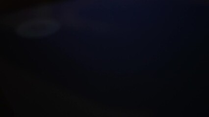 Cell phone user turns off power his smart phone. Power off smartphone. Shutting down mobile phone, closeup. Close up, macro, finger slides to side touch screen display to turning off smartphone.