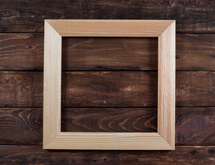 Wooden frame on wooden background
