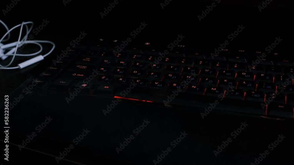 Poster keyboard with red backlight. computer accessories for typing in the dark.