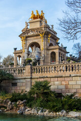 Fototapeta na wymiar Ornate architecture with golden statues on top in a park in Barcelona, Spain.