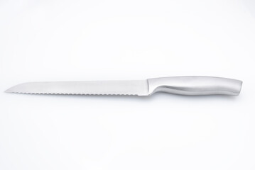 Steel Bread knife up close photographed on clean white glossy background 