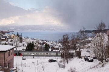 The Norwegian port city of Narvik in winter scenery. Traditional buildings of city.