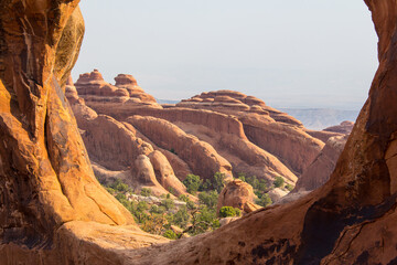 Obraz premium Views from a hike to Double-O Arch of the unique sandstone rock formations caused by erosion in Utah at Arches National Park