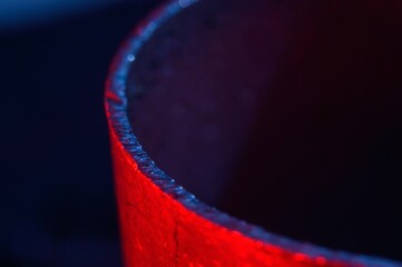 metal scraps. Macro. illuminated in red and blue.
