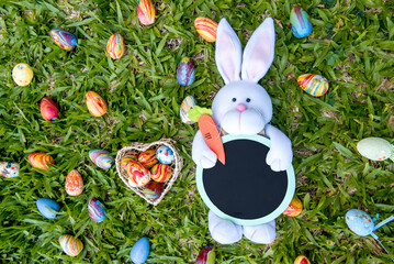 colorful easter eggs and easter bunny on the grass