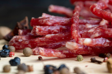 Dried veal sausage during slicing