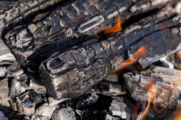 kindling a fire made of wood during outdoor recreation