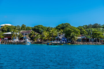 Fototapeta na wymiar A view of boats and buildings at West Bay on Roatan Island on a sunny day
