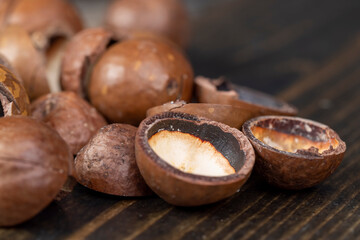 Unpeeled macadamia nuts on the table