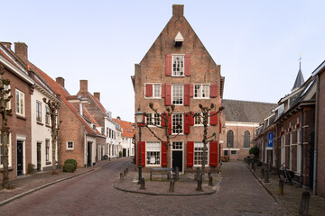 Narrow streets in the center of Amersfoort with the Elleboogkerk in the background.