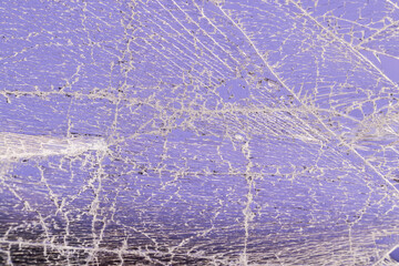 glass broken into a large number of pieces and cracks