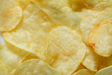 Macro Potato Snacks,Crispy potato chips texture background top view,abstract background of potato chips food texture 